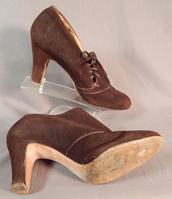 Vintage Marquise Footwear Brown Suede Leather Side Lacing Trim Art Deco Shoes
These lovely ladies day shoes have decorative side lacing with the original brown shoe string laces, rounded toes and brown suede leather covered modified boulevard high heels. 