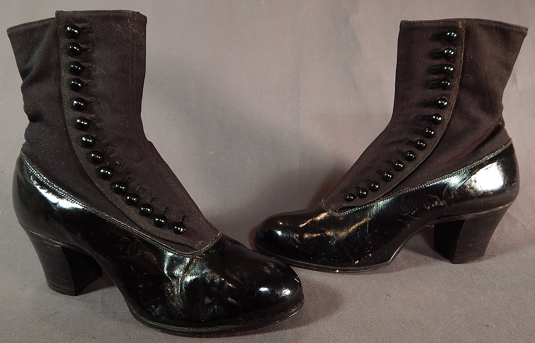 Victorian Unworn Womens Black Wool Patent Leather High Top Button Boots
These beautiful boots have rounded toes, 14 black shoe buttons along the side for closure and stacked black wooden cube heels. The boots measure 8 inches tall, 9 1/2 inches long and 3 inches wide, with 2 inch high heels.