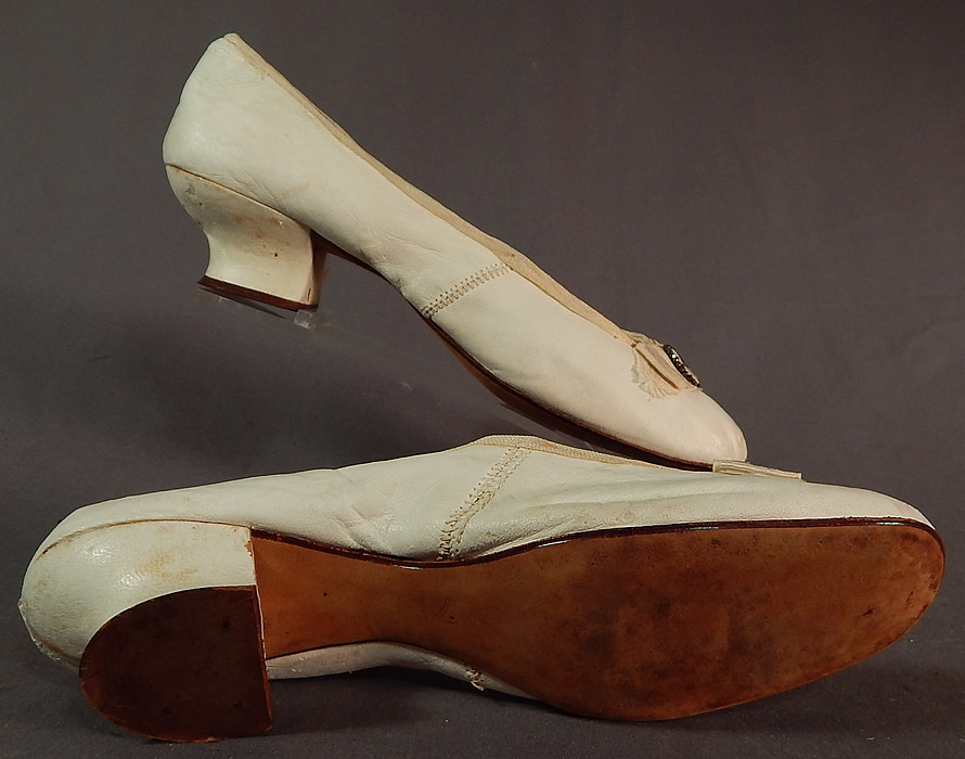 Victorian White Kid Leather Steel Cut Beaded Buckle Silk Bow Wedding Shoes
They are in good condition and have been gently worn, with some minor wear, faint stains and flaking leather on the heels.