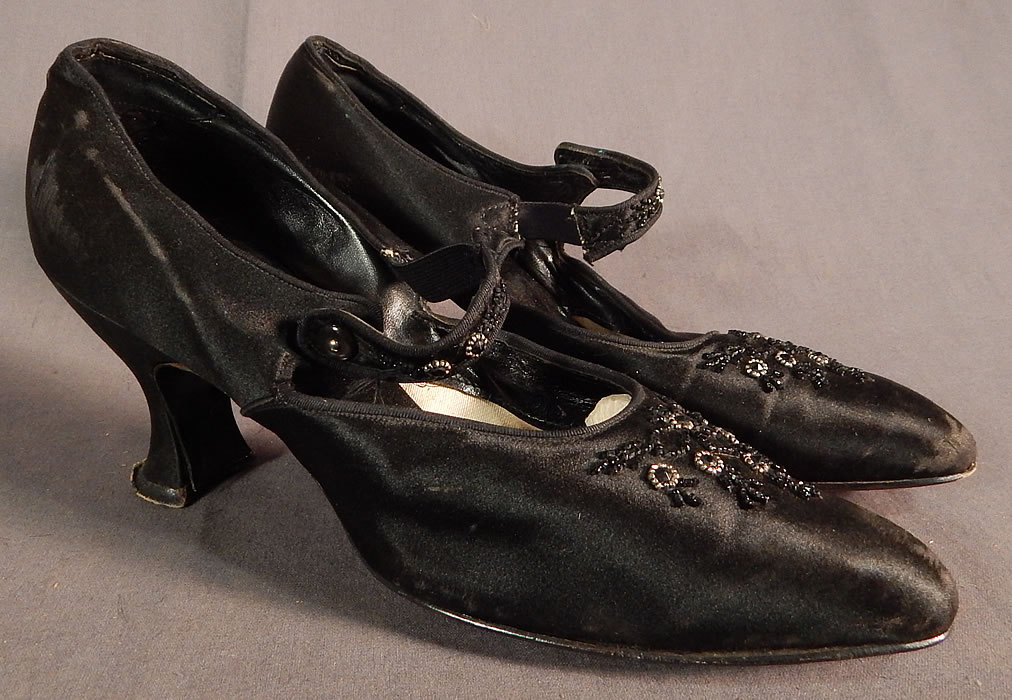Edwardian Vintage Gundlach's Black Silk Beaded Button Strap Mary Jane Shoes
This pair of Edwardian era vintage Gundlach's black silk beaded button strap Mary Jane shoes date from 1910