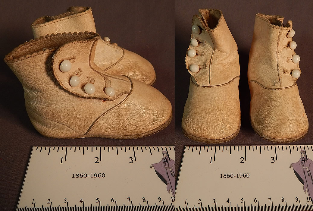 Edwardian Tan Kid Leather High Button Baby Boots Infant Childrens Shoes
They are made of a cream tan color kid leather, with four white glass buttons for closure and scalloped trim along the tops. 