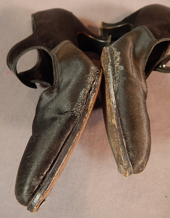 Edwardian Vintage Sommer and Kaufmann Black Silk Button Strap Mary Jane Shoes
The shoes have been worn and are in fair as-is condition, with some frayed separation along the inner sides of the bottom of each shoe which someone had tried to repair with glue (see close-ups).