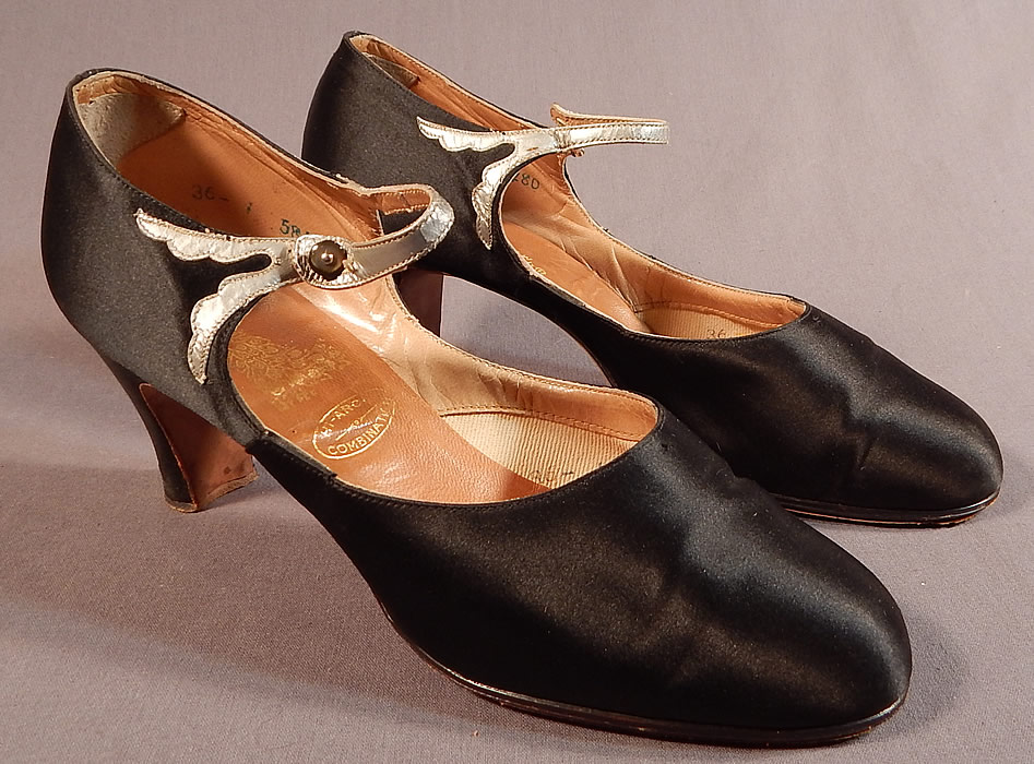Vintage Peacock Shoe Art Deco Black Silk Satin Silver Button Strap Mary Jane Shoes
They are made of a black silk satin fabric with a decorative silver metallic leather trim accent, button strap across the instep.