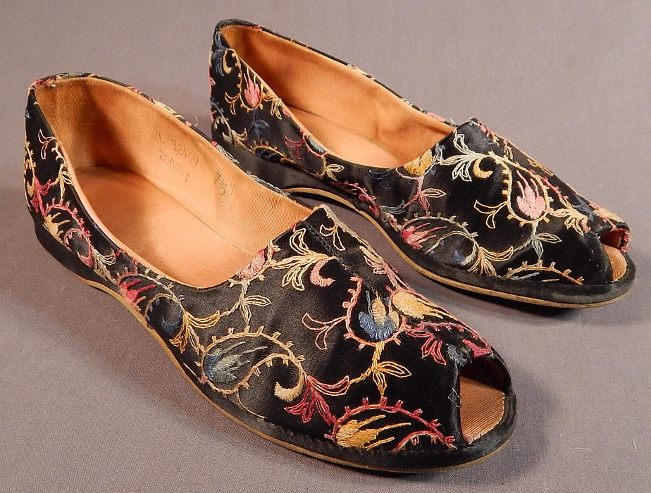 Vintage Black Silk Satin Colorful Tambour Embroidery Boteh Paisley Slipper Shoes
This pair of vintage black silk satin colorful tambour embroidery boteh paisley slipper shoes date from the 1940s. They are made of a black silk satin fabric, with colorful tambour embroidery work done in a boteh paisley pattern design. 