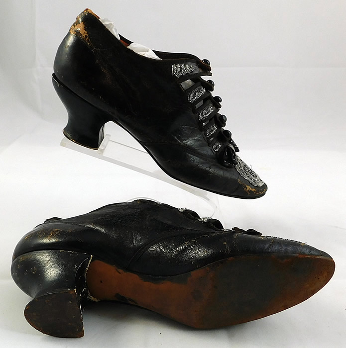 Victorian Antique Brown Leather Steel Cut Beaded 5 Button Strap Shoes
The shoes measure 9 inches long, 2 1/2 inches wide, with 2 inch high heels.