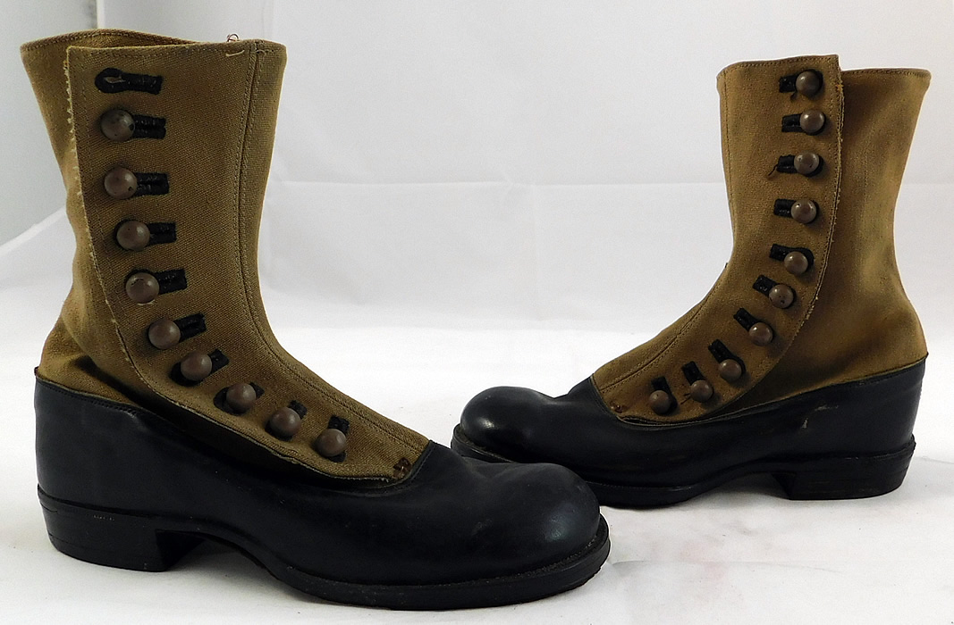 Unworn Victorian Two Tone Khaki Canvas Leather High Top Button Boots
These youth child size beautiful boots have rounded bulbous toes, the 10 khaki color buttons along the side for closure and stacked wooden black low cube heels. 
