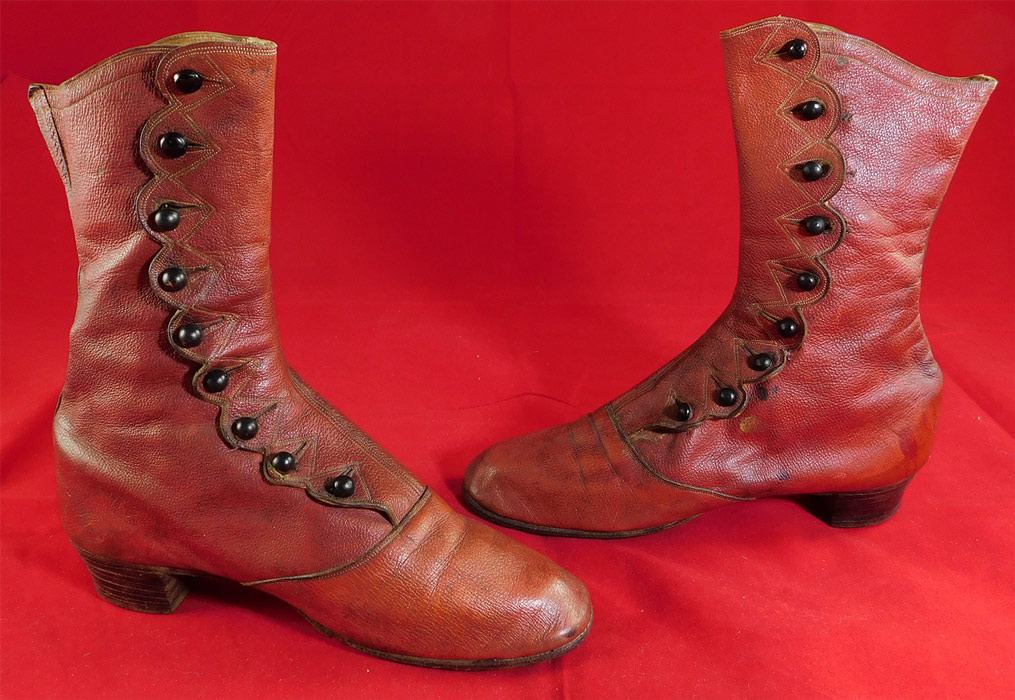 Victorian Rare Red Leather Scalloped High Top Button Boots Shoes
This pair of antique Victorian Civil War era rare red leather scalloped high top button boots shoes dates from the 1860s.