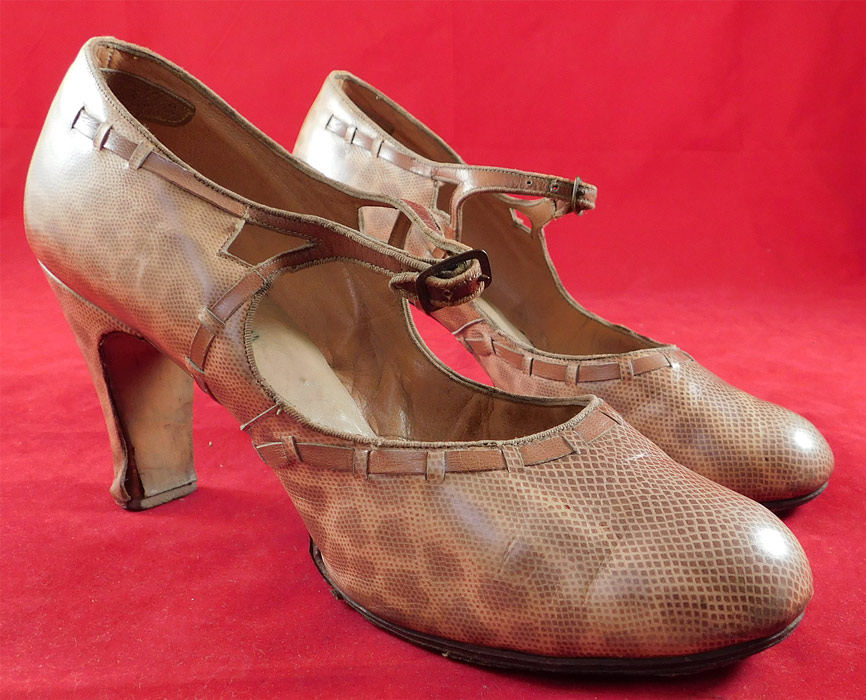 Vintage Art Deco Spotted Snakeskin Print Leather Mary Jane Buckle Strap Shoes
These stunning snakeskin shoes have a Mary Jane style with decorative cutouts, an adjustable buckle strap closure across the instep, rounded toes and snakeskin print leather covered modified boulevard high heels.