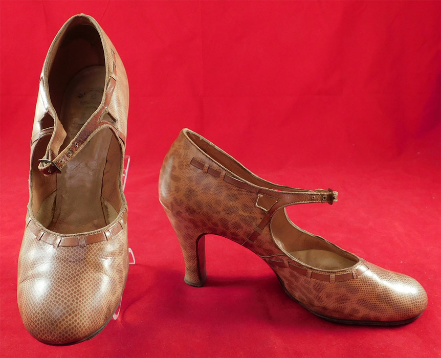 Vintage Art Deco Spotted Snakeskin Print Leather Mary Jane Buckle Strap Shoes
This pair of vintage Art Deco spotted snakeskin print leather Mary Jane buckle strap shoes date from the 1930s. They are made of a two tone tan leather with a spotted faux snakeskin embossed print pattern and leather trim edging woven through. 