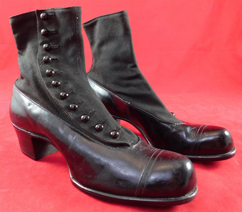 Unworn Edwardian Black Wool Cloth Leather Button Boots & Shoe Box
These womens beautiful black boots have rounded bulbous toes, 11 black shoe buttons along the side for closure and black stacked wooden cube heels. 