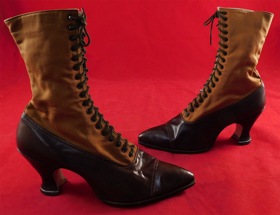Unworn Victorian Two Tone Brown Cloth & Leather High Top Lace-up Boots
They are made of a two tone brown color with a lighter golden brown cloth canvas fabric upper boot and a dark brown leather bottom shoe with decorative punch work designs on the toes. 