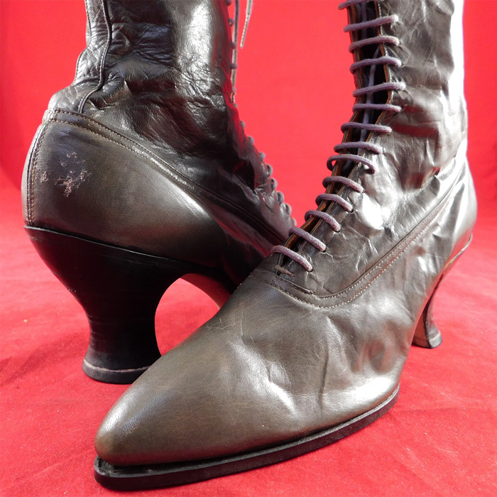 Victorian Unworn Gray Leather High Top Lace-up French Spool Heel Boots
They are old store stock, in unworn good wearable condition, with only some scuffs on the leather back heel of one shoe (see close-up). 