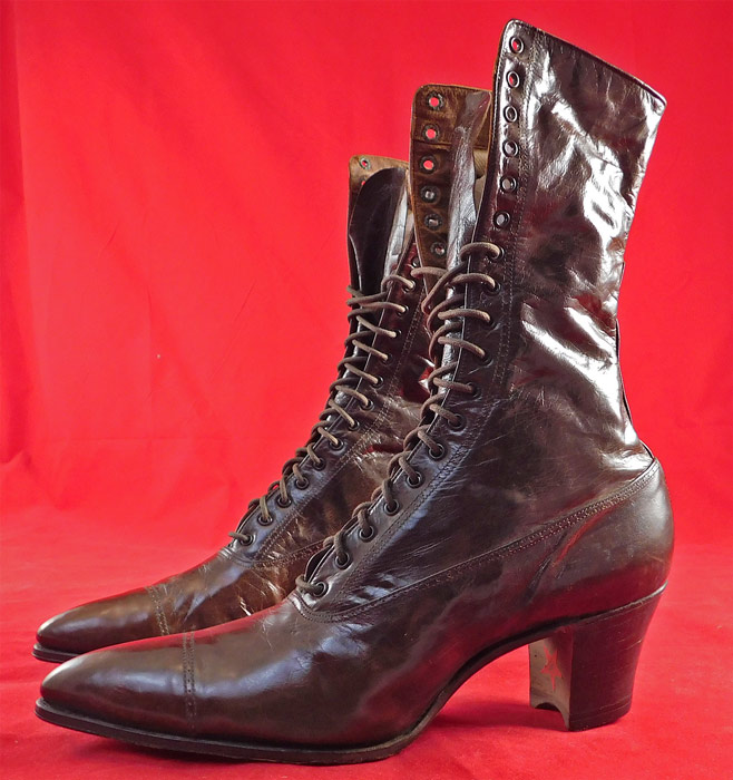 Edwardian Antique Dark Brown Leather High Top Lace-up Cube Heel Boots
They are made of a dark brown leather, with decorative punch work designs across the front toes.