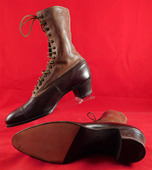 Victorian Unworn Two Tone Brown Leather High Top Lace-up Boots Cube Heels
The boots measure 9 inches tall, 9 1/2 inches long, 3 inches wide, with 1 1/2 inch high heel and are stamped inside a European size 34.
