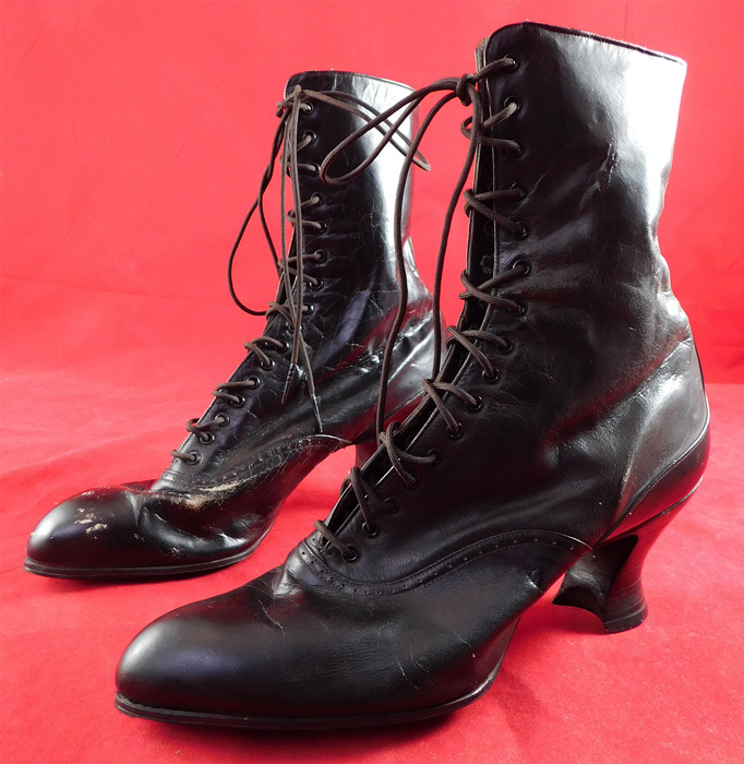 Victorian Unworn Black Leather High Top Lace-up French Spool Heel Boots
They are lined in green silk around the tops and stamped inside "Albert J. Holzhauser Mt. Healthy, Ohio" label. The boots measure 9 inches tall, 9 1/2 inches long, 3 inches wide, with 2 1/2 inch high heels. 