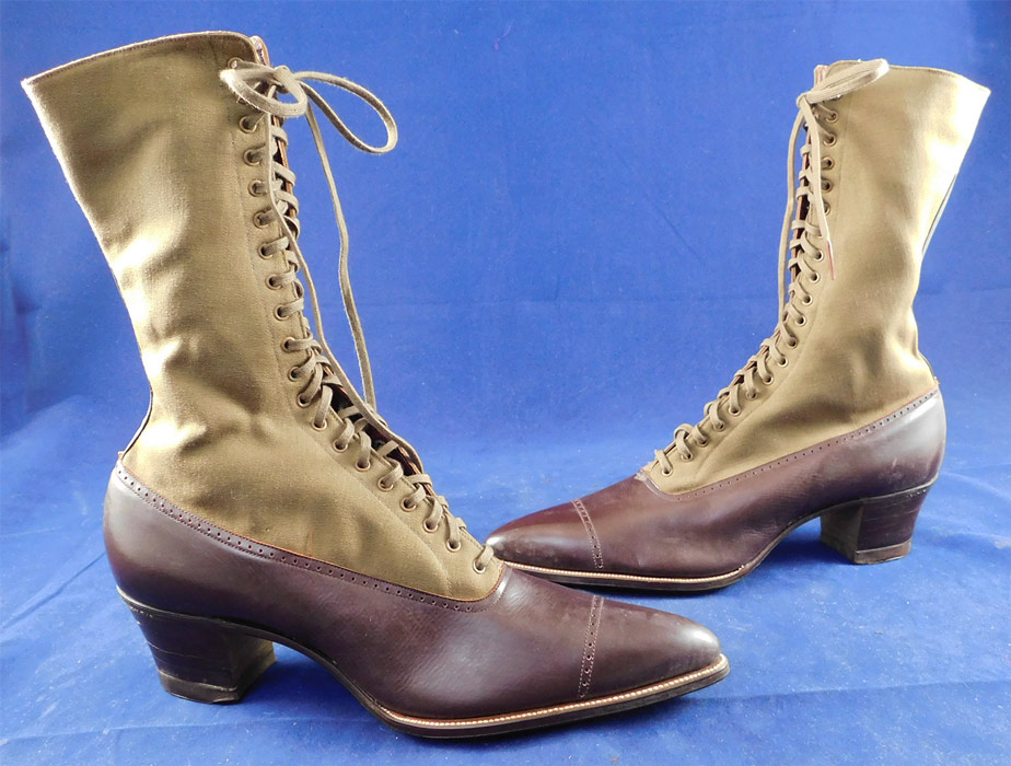 Unworn Edwardian Two Tone Brown High Top Laceup Cloth Boots & Spiderweb Shoe Box
These beautiful boots have a two tone color combo, with pointed toes, the original khaki shoe string laces for closure and stacked wooden cube heels with "GoodYear Pat. June 1, 1915" stamped on the bottom rubber heel caps.