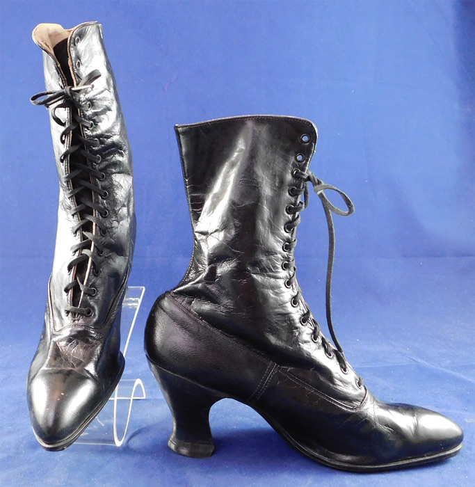 Victorian Unworn Black Leather High Top Lace-up French Spool Heel Boots
The boots measure 9 1/2 inches tall, 9 1/2 inches long, 2 3/4 inches wide, with 2 1/2 inch high heel and are approximately a US size 6 or 7 narrow width. 