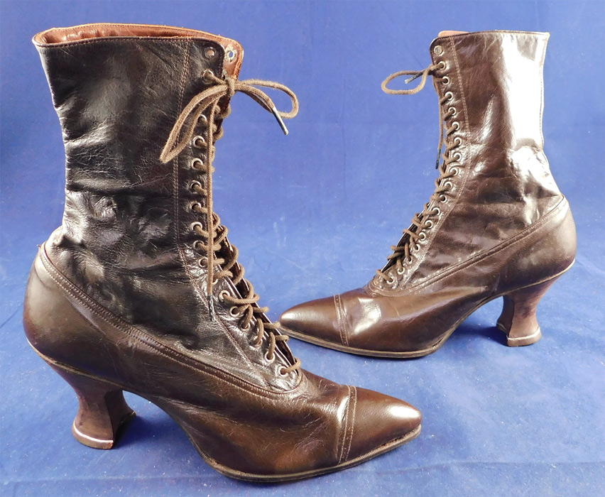 Edwardian Vintage Broadway Girl Women's Brown Leather High Top Lace-up Boots
They are made of a dark brown leather, with decorative punch work designs across the front toes. 