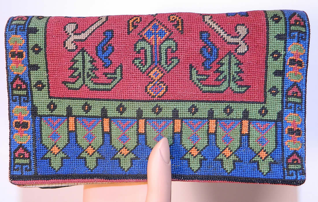 Vintage Oriental Rug Petit Point Needlepoint Embroidered Clutch Bag Purse. It is made of a bright colorful petit point needlepoint hand embroidery work done in an Oriental rug geometric pattern Moorish influenced inspired design. 
