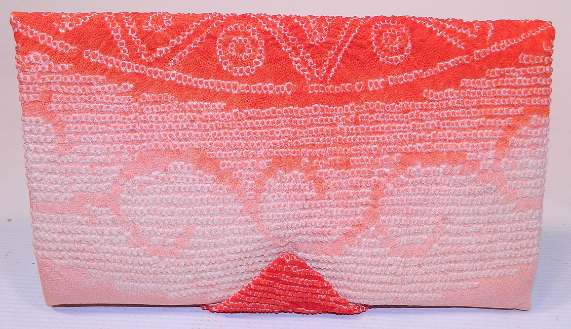 Vintage Japanese Red White Pink Ombre Silk Shibori Tie-Dye Fabric Clutch Purse
This exquisite envelope style clutch purse has a snap closure, silk lining inside, with pockets and round compact mirror with original tag still attached and comes in the box.