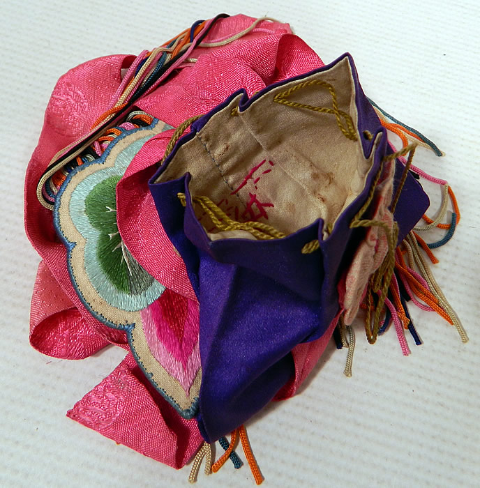 Antique Chinese Colorful Silk Embroidered Lotus Flower Fringed Pouch Purse Bag
These pouches also called pockets were meant to hold small things such as coins or seals since there were no pockets on the clothing. The purse measures 6 inches long, 4 inches wide and has an 8 1/2 inch long fringe trim. It is in good condition. This is truly a beautiful one of a kind piece of antique Chinese textile art! 