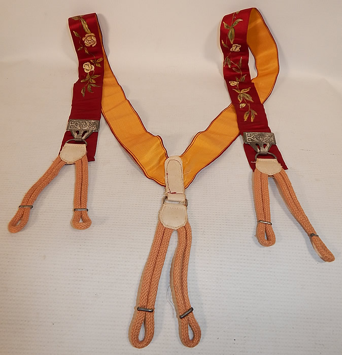Victorian Red Silk Hand Painted White Rosebud Roses Suspenders Braces
These antique Victorian era gentleman's red silk hand painted white rosebud roses suspenders braces date from 1900. They are made of dark red burgundy color silk fabric, with hand painted white rosebud, rose flowers.