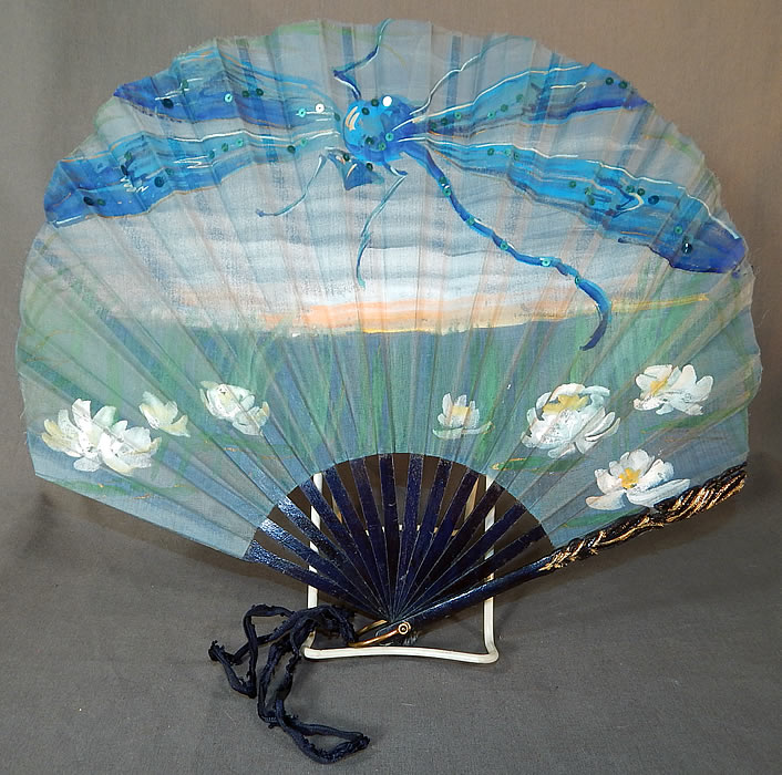 Vintage Art Nouveau Hand Painted Silk Dragonfly Water Lily Sequin Pleated Folding Fan
This Edwardian era antique Art Nouveau hand painted silk dragonfly, water lily sequin pleated folding fan dates from 1910.