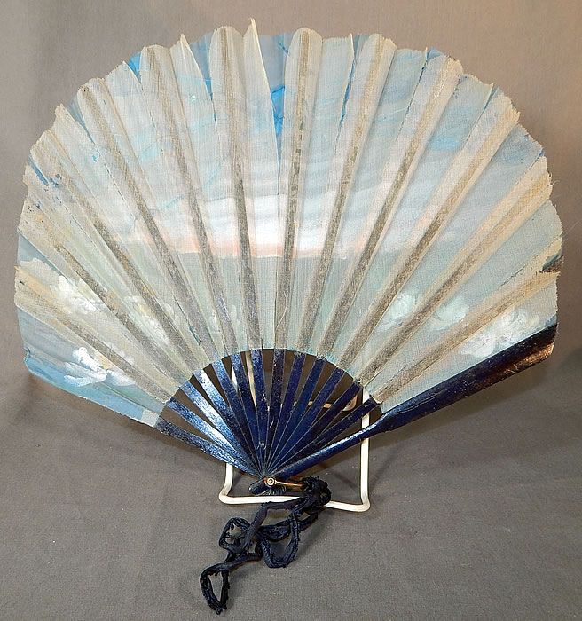 Vintage Art Nouveau Hand Painted Silk Dragonfly Water Lily Sequin Pleated Folding Fan
This fabulous folding fan has an Art Nouveau, Japonism influenced design, with painted dark blue and gold highlighted carved wooden guards, sticks, a gold brass rivet, loop ring at the bottom holding the fan together and navy blue silk ribbon for carrying. 