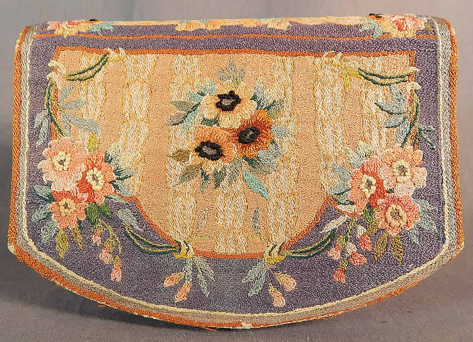 Vintage Angelic Cherub Cupid Petit Point Needlepoint Embroidered Clutch Purse
This pretty purse has a clutch envelope style, with a fold over flap snap closure, blue and yellow silk moire lined with inside pockets, beveled mirror insert and two small coin purses. 