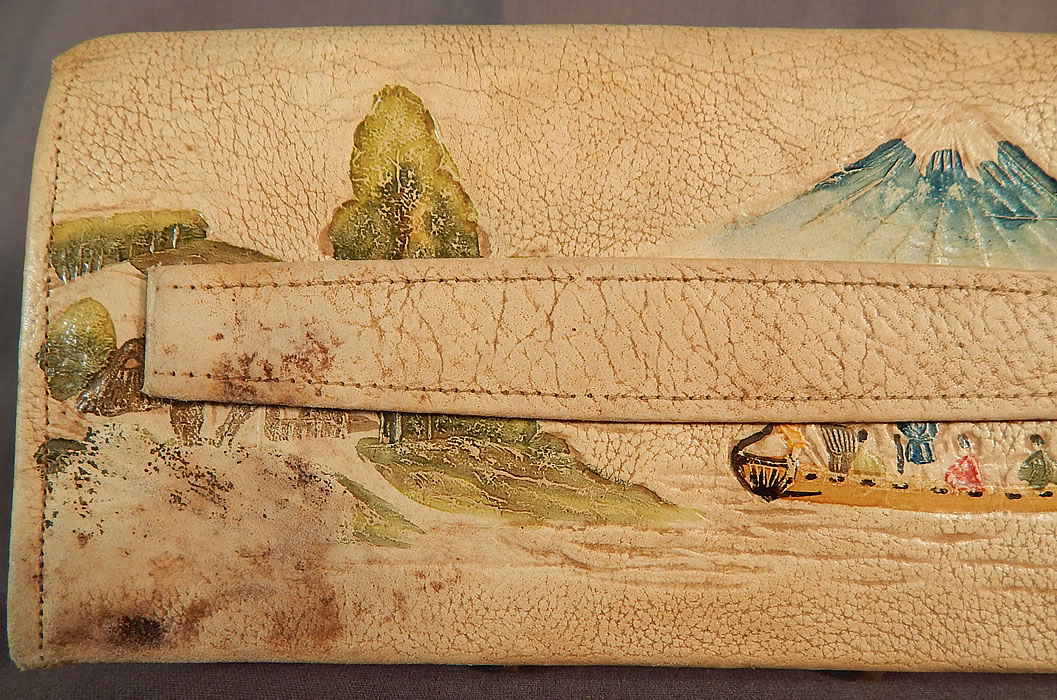 Vintage Antique Japanese Hand Tooled Leather Painted Clutch Purse & Wallet
This pretty purse has a clutch envelope style, with a fold over flap snap closure, gold yellow silk lined with inside pockets, a ball clasp inner coin purse and a smaller coin purse on the bottom outside corner.
