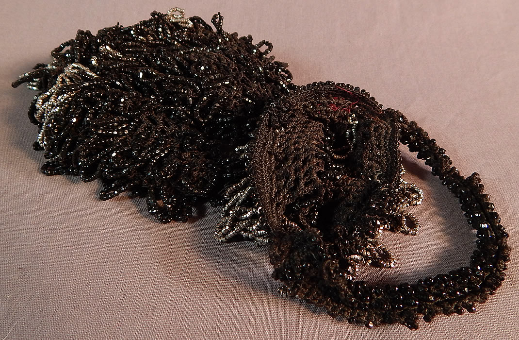 Vintage Art Deco Black Crochet Jet Silver Steel Cut Beaded Drawstring Flapper Purse
This fabulous flapper handbag pouch purse has a drawstring style, with beaded carrying strap, open top, no closure, beaded loop fringe tassel bottom and is unlined