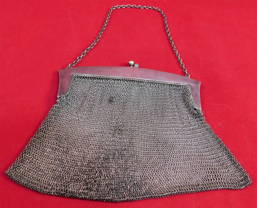 Vintage Ellessem German Alpacca Silver Mesh Chainmail Art Nouveau Floral Purse
It is in good as-is condition, with only some tarnish discoloration on the back and some loose links breaks along the chainmail on the frame hinge area (see close-ups). This is truly a wonderful piece of Art Nouveau wearable handbag art! 