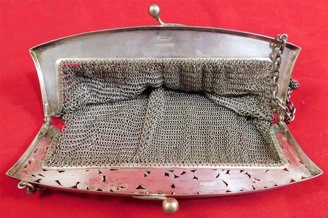 Vintage Ellessem German Alpacca Silver Mesh Chainmail Art Nouveau Floral Purse
The purse measures 6 by 6 inches with a 15 inch long strap.