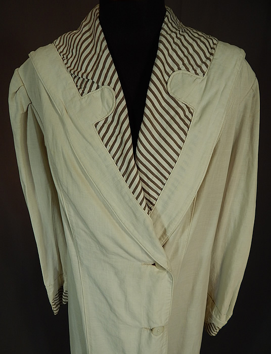 Vintage Linen Striped Sailor Shawl Collar Womens Duster Driving Motoring Coat
This wonderful women's duster motoring coat is a long floor length, with a wide lapel shawl sailor style collar, gathered shoulders, long sleeves with rolled cuffs, 3 large mother of pearl buttons on the side front for closure and is unlined. 