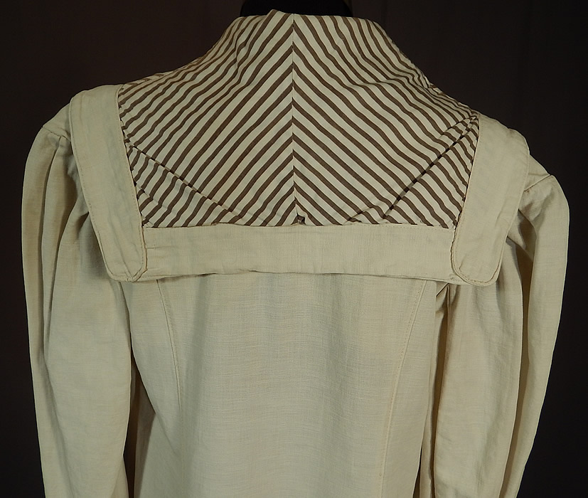 Vintage Linen Striped Sailor Shawl Collar Womens Duster Driving Motoring Coat
The coat measures 49 inches long, with a 36 inch bust, 32 inch waist, 44 inch hips, 14 inch back and 23 inch long sleeves. This coat would have been worn to protect ones clothing from the dust and mud when traveling, riding and driving in a motor car.