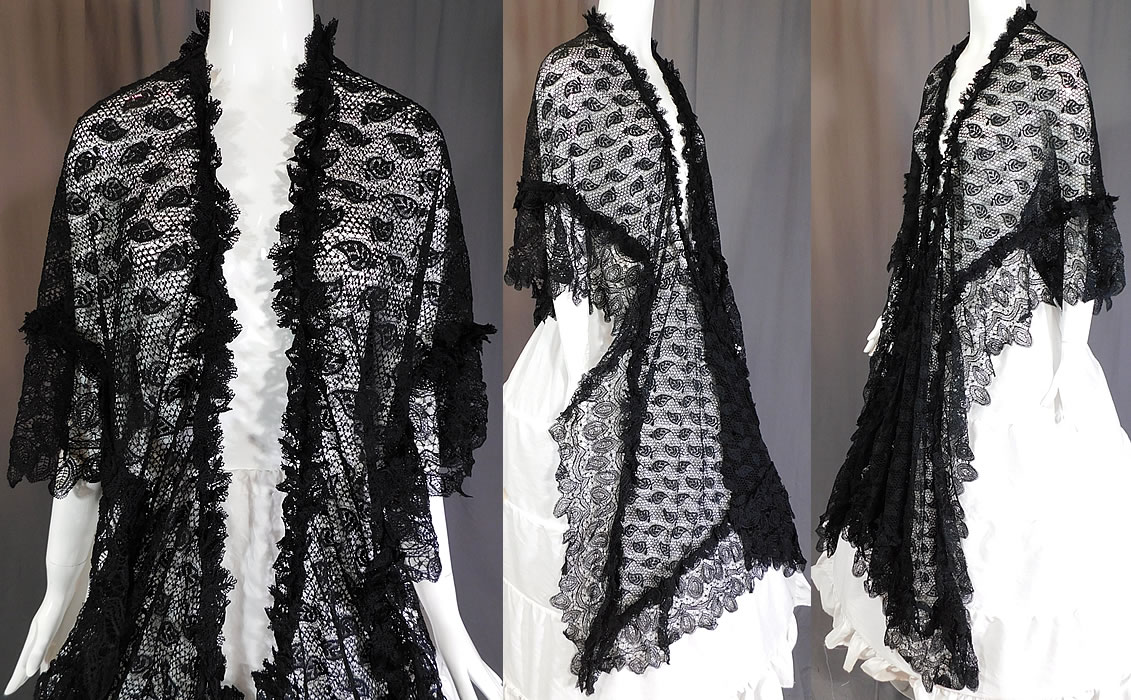 Victorian Antique Black Lace Dolman Mantle Pelerine Shawl Cloak Cape
This lovely lace large dolman mantle pelerine shawl style cloak cape has a ruffled trim edging, scalloped lace trim bottom, with long lappet ends, an open front with no closure and is sheer, unlined. 