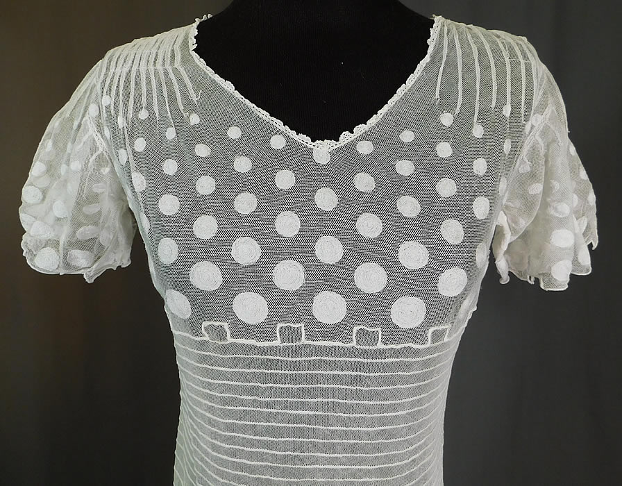 Vintage Polka Dot Embroidered White Tulle Net Pleated Shift Drop Waist Dress
The dress measures 44 inches long, with a 34 inch bust, 30 inch waist, 34 inch hips and a 12 inch back.