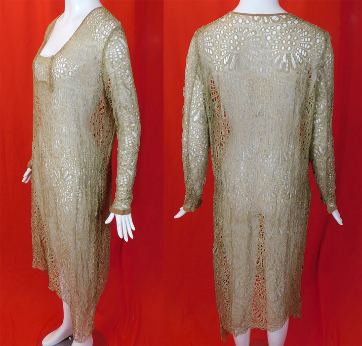 Vintage Beige Ecru Sheer Silk Eyelet Drawn Cutwork Lace Handkerchief Hem Dress
This lovely lace dress has a loose fitting drop waist style with an uneven asymmetrical handkerchief hemline skirt, long tapered sleeves with snap closure cuffs, a squared neckline and is sheer, unlined. 