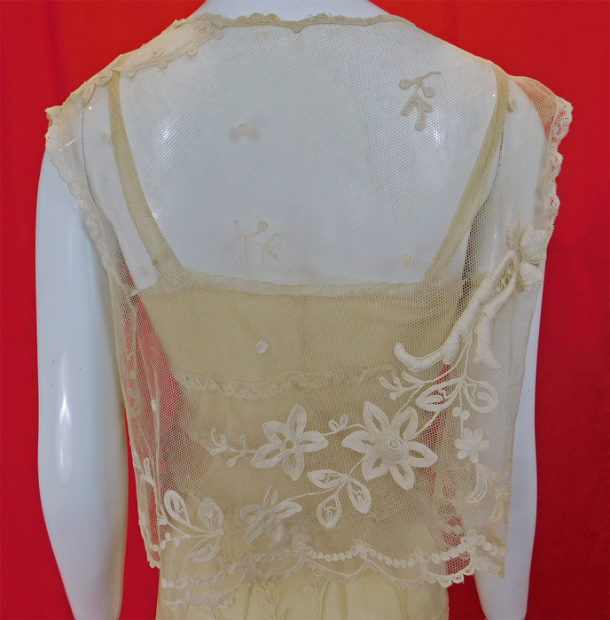 Vintage Cream Tambour Embroidery Net Lace Dress Slip Vest Jacket Top
It is in good condition and has not been cleaned with only faint yellowing discoloration in areas. This is truly an exquisite piece of wearable lace art.