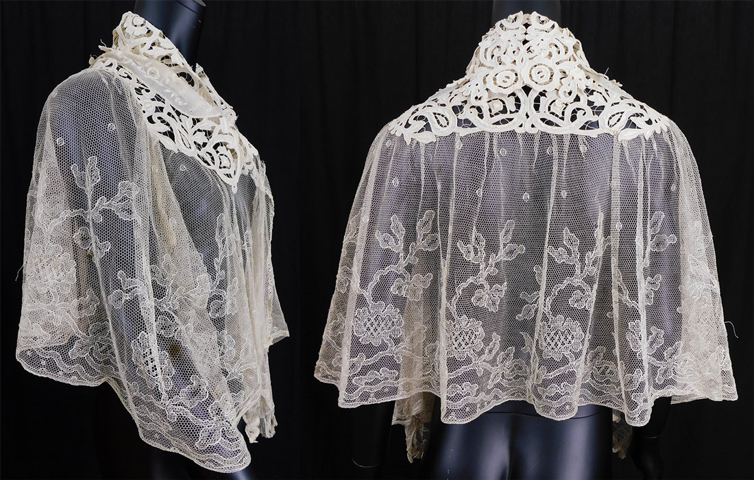 Victorian Cream Embroidered Net Tape Lace Shawl Collar Cloak Cape Pelerine
This lovely lace shawl style pelerine cloak cape is mid length with pointed ends down the center front, has an open front with no closure, a decorative lace trimmed fold over collar and is sheer, unlined. 