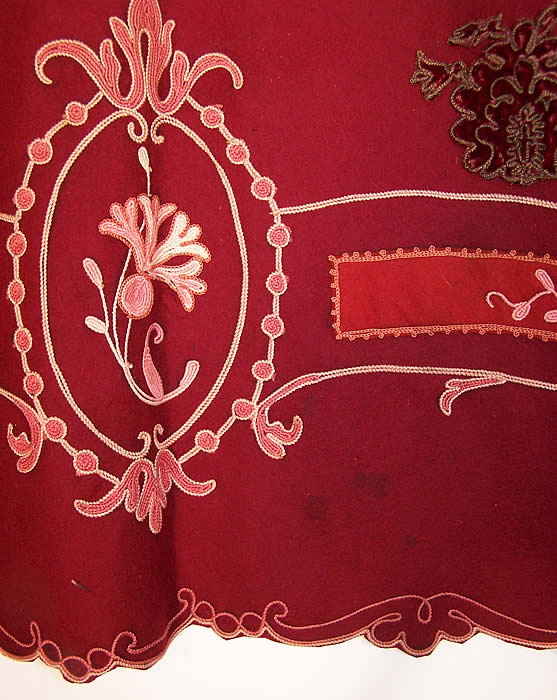 The Gallery of Wearable Art Burgundy Wool Embroidered Coat  Close up.