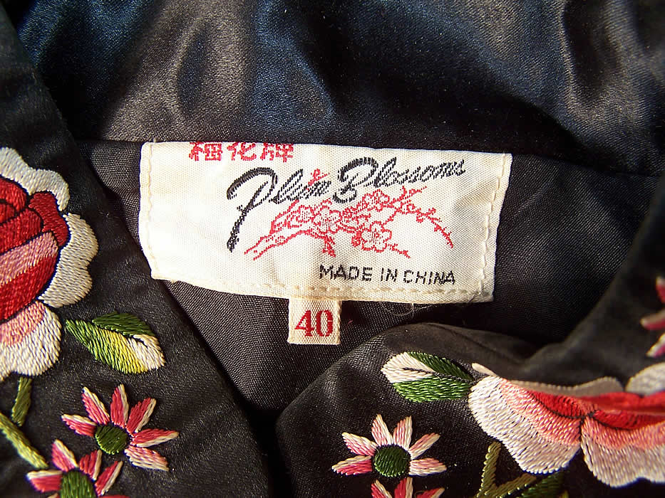 Vintage Plum Blossoms Chinese Black Silk Embroidered Floral Bird Coat label close up.