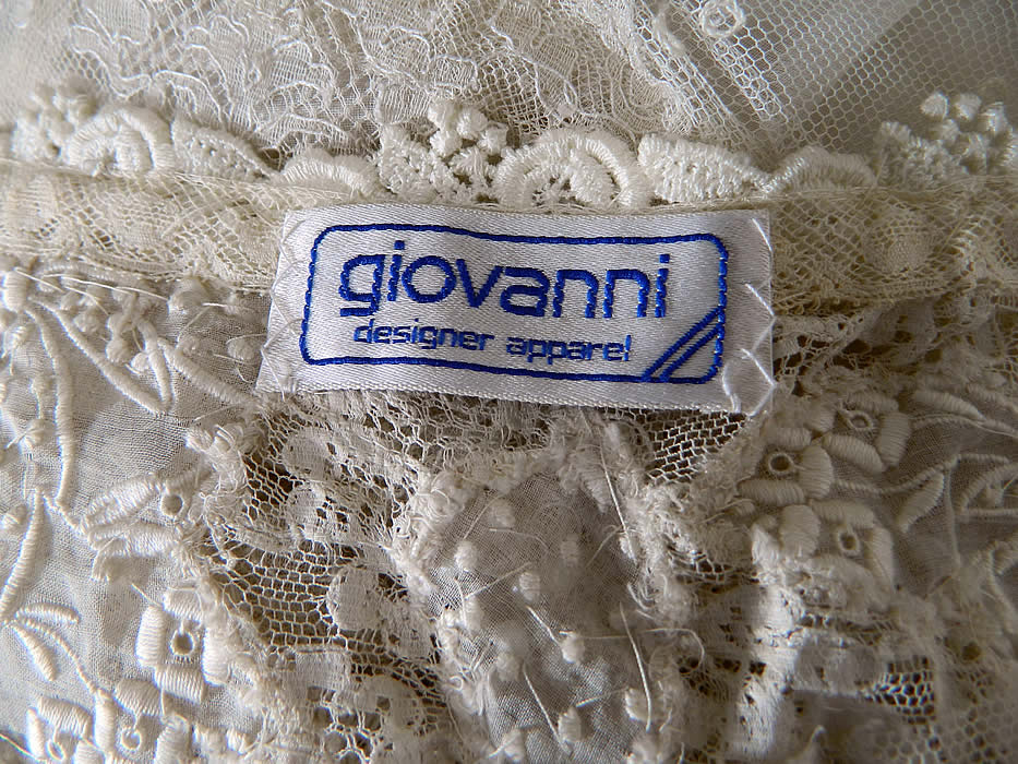 Vintage Giovanni Designer Apparel White Lace Drop Waist Wedding Dress label close up.