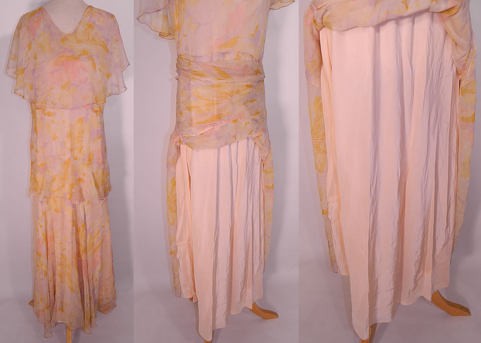 Vintage Pastel Silk Chiffon Floral Print Shawl Collar Bias Cut Dress. This beautiful bias cut dress is a long floor length, with a large layered flounce shawl collar cape, sleeveless, with a layered peplum waist tiered skirt and side snap closures. 