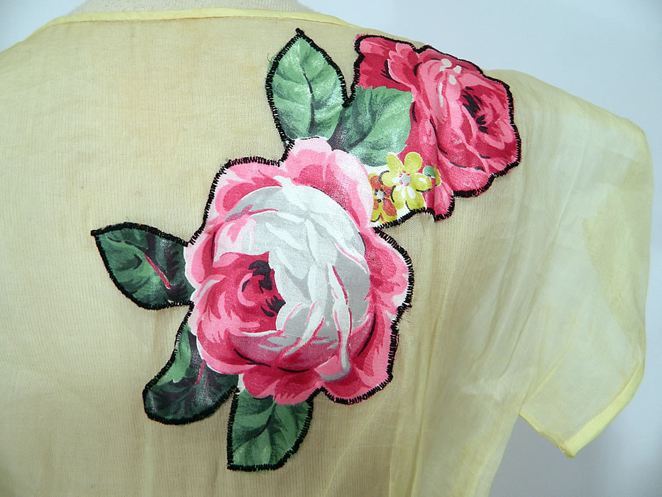 Vintage Yellow Organdy Pink Roses Chintz Applique Belted Dress. The dress measures 54 inches long, with a 24 inch waist and 34 inch bust. It is in good condition. This is truly a wonderful piece of wearable art!