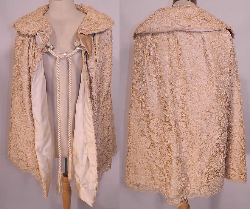 Victorian Cream Silk Soutache Net Lace Wedding Cloak Cape. This beautiful bridal wedding cloak cape is a long mid length, has a rounded wide shawl collar, white silk rope tie closure on the front with added newer rosette flower trim and is fully lined.