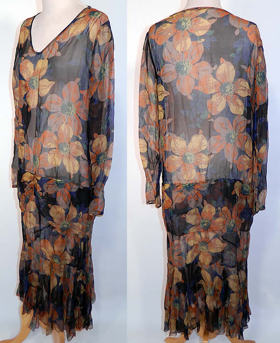 Vintage Black & Yellow Floral Poppy Print Silk Chiffon Drop Waist Dress.  This fabulous flapper dress has a loose fitting drop waist style, with a V front neckline and long sleeves. It is sheer and unlined. The dress measures 48 inches long, with 36 inch hips, a 38 inch waist, 38 inch bust, 14 inch back and 24 inch long sleeves.