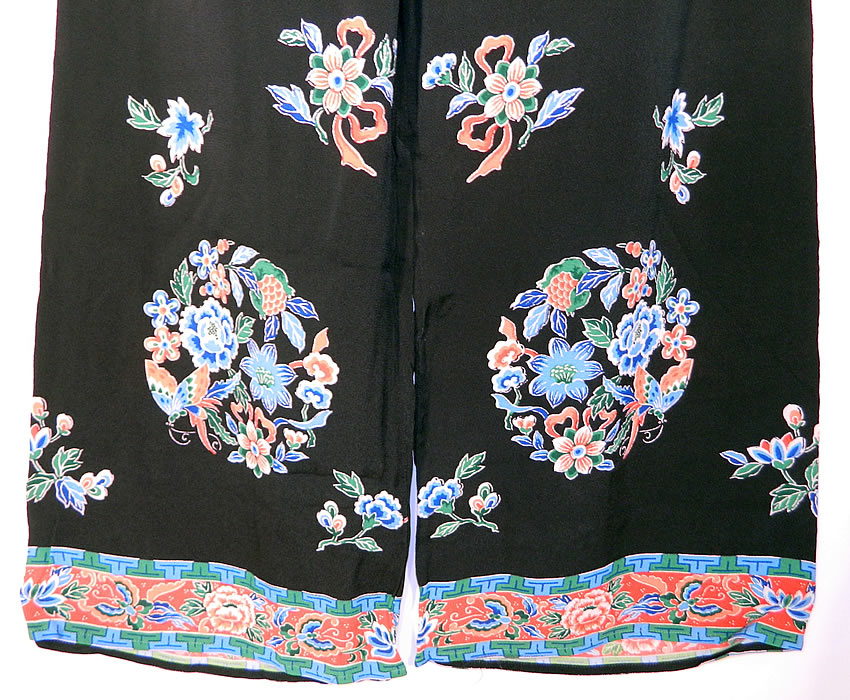 Vintage Chinese Black Silk Screen Floral Butterfly Pajama Lounge Set.There are matching silk screen loose fitting pants, with flared wide leg cuffs, a V front top elastic back waistband and are unlined. The pants measure 40 inches long, with a 25 inch inseam, 38 inch hips, a 34 to 36 inch waist and 22 inch circumference cuffs. 