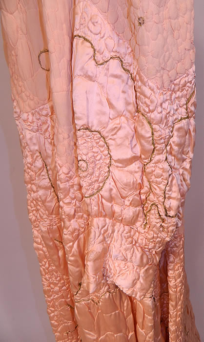 Vintage Harrods Pink Silk Quilted Gold Trim Stitched  Peignoir Robe Dressing Gown. The robe measures 60 inches long, with 45 inch hips, a 40 inch waist, 40 inch bust, 15 inch back and 31 inch long sleeves.