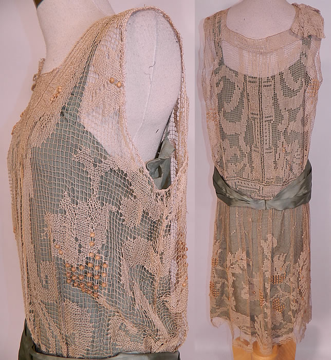 Vintage Teal Silk Ecru Filet Lace Wooden Beaded Drop Waist Belted Dress. The dress measured 43 inches long, with 38 inch hips, a 28 inch waist and 36 inch bust. It is in good condition, with only some fraying of the inside silk lining under the arms. This is truly an exceptional piece of wearable antique lace art! 